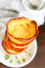 Abstract blurred background  with pile of empty tartlets