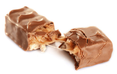 Tasty broken chocolate bars isolated on white background