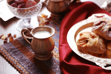 Antique tea-set with Turkish delight and baking on table close-up