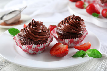 Chocolate cupcakes on plate closeup