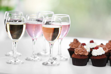 Tasting of wine and chocolate cupcakes, close up