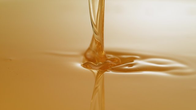 Pouring honey. Shot with high speed camera, phantom flex 4K. Slow Motion.