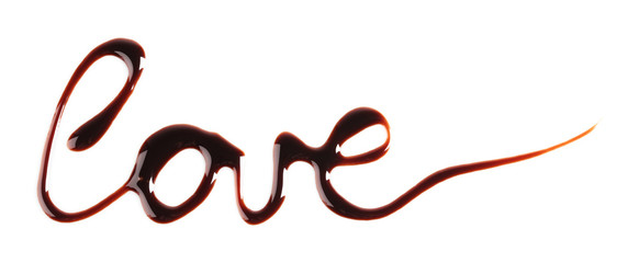 A word "love" written with chocolate, isolated on white