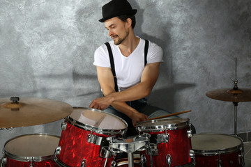 Fototapeta na wymiar Musician playing the drums in a studio