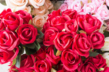 Colourful artificial flower made from plastic and fabric.