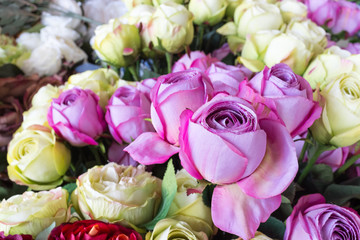 Colourful artificial flower made from plastic and fabric.