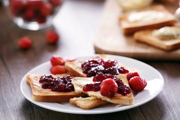 Served table for breakfast with toast and jam, close-up