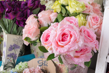Colourful artificial flower made from plastic and fabric.