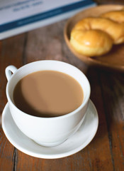 hot coffee with sugar bread and newspaper