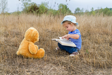 Cute girl reading book Teddy bear - 96414724