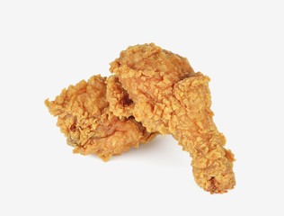 Golden brown fried chicken drumsticks on white background