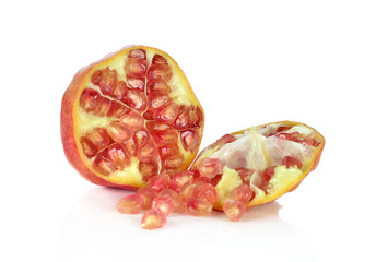 Ripe pomegranate fruit on white background