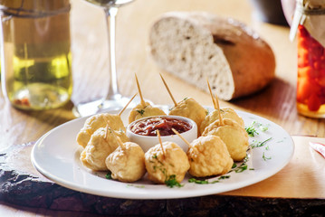 potato balls with sauce
