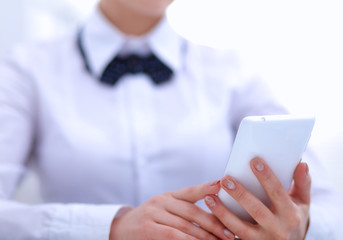 Woman in office using mobile phone
