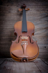 Vintage violin on wooden background