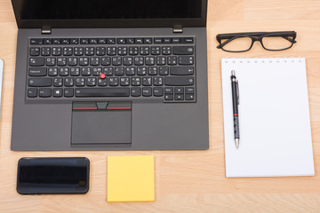 black laptop with tablet and smart phone