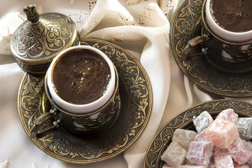 Turkish coffee with delight and traditional copper serving set