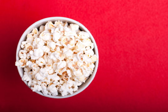 Box Of Popcorn On A Red Background, Top View