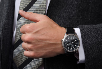 stylish wrist watch on his hand businessman
