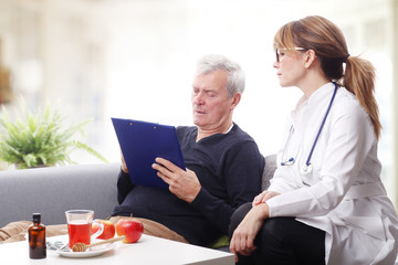 Old patient and female doctor