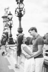 shopping in Paris, fashion woman and men near Eiffel Tower in France, Europe
