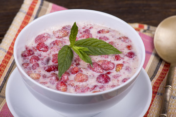 Fresh strawberry milk in a plate