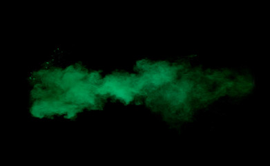 Freeze motion of green dust explosion on black background