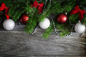 Christmas garland on rustic wooden table with copy space