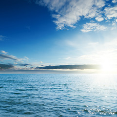 Obraz premium sunset over blue sea