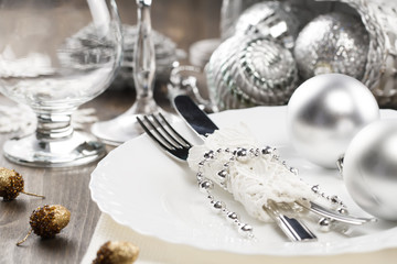 Christmas dinner table. Traditional Christmas decorations. Romantic table setting.
