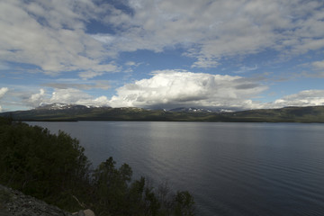The lake Tornesträsk in north of Sweden and mountains in the background
