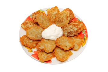 potato pancakes with sour cream isolated on white background