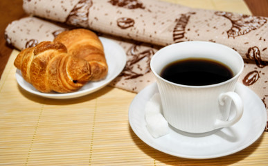 Breakfast with coffee and croissants