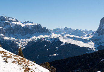 Fototapeta na wymiar Skiing area in the Dolomites Alps. Overlooking the Sella group in Val Gardena. Italy