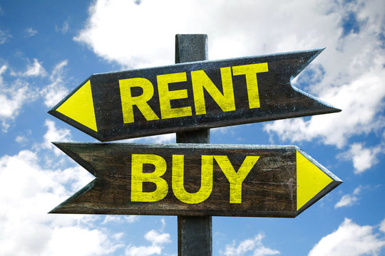 Rent - Buy signpost with sky background