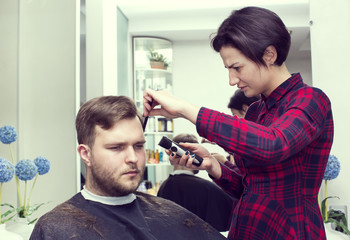 The young man at the hairdresser salon hairstyle make model