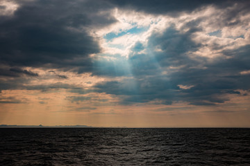 Sunbeams breaking through stormy skies in Iceland. 