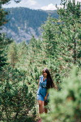 Naklejka na ściany i meble long hair woman travel in spruce forest