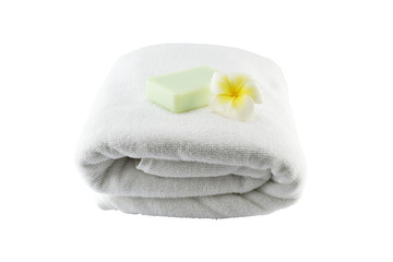 Obraz na płótnie Canvas Spa treatment with soap towels and flower on white background