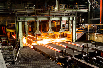 hot steel on conveyor in steel mill - obrazy, fototapety, plakaty