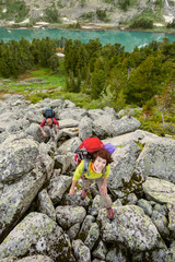 Young people are hiking in highlands of Altai mountains, Russia