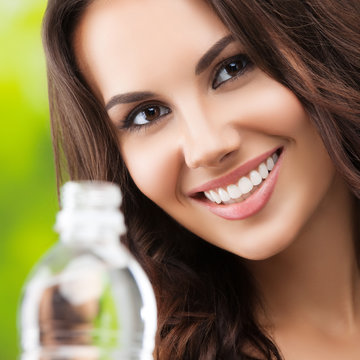 Young woman with bottle of water