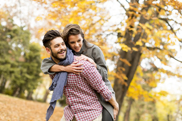 Young couple in the autumn forest
