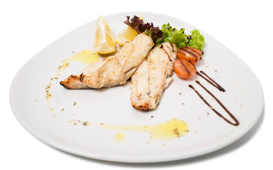 Grilled fish fillet with vegetables.
