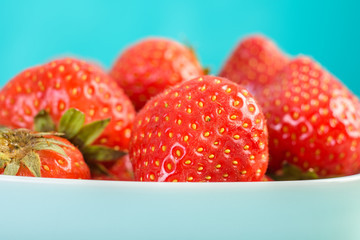 Strawberry Bowl On Blue Background