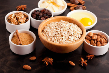 oat flakes and ingredients on a black table