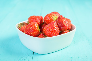 Strawberry Bowl On Blue Background