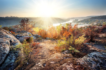 Dawn on banks of mountain river