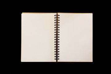 Open diary isolated on black background.