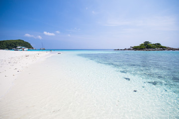 beautiful tropical beach with calm blue sea surf